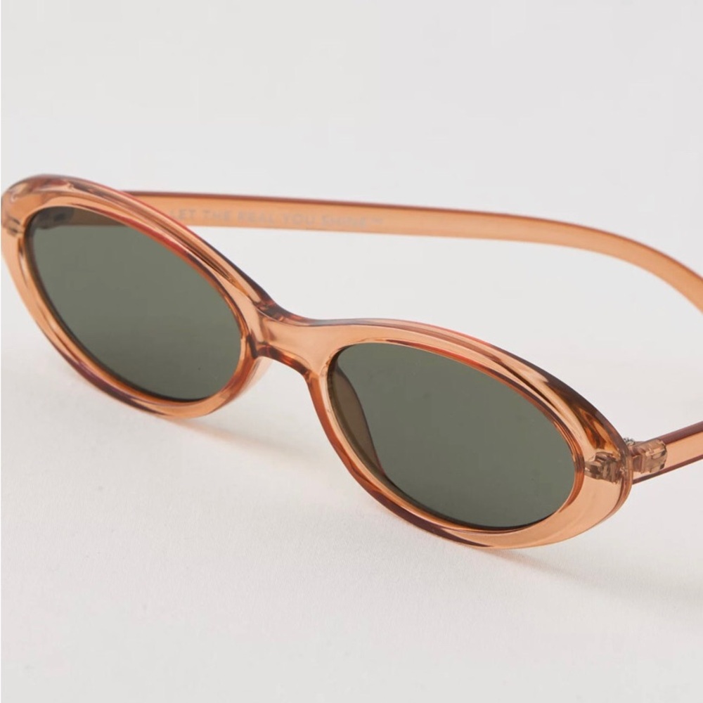 aerie Translucent Amber Oval Sunglasses with Dark Lenses - Picture 1 of 5